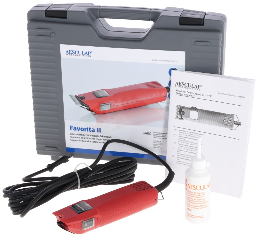 Rote AESCULAP Schermaschine Favorita II ohne Scherkopf mit grauem Koffer, Ölflasche und Anleitung.